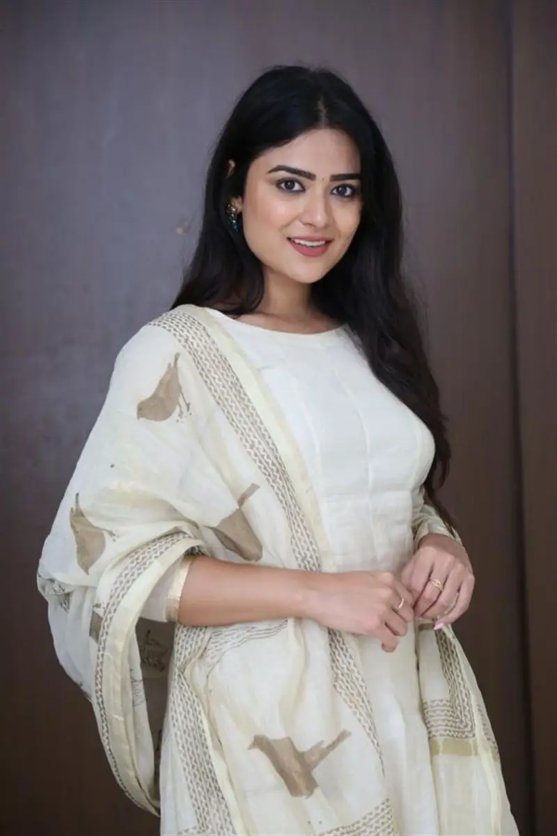 Telugu Actress Priyanka Sharma Smiling Stills in White Dress